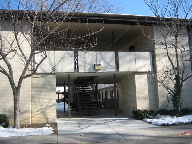 Multi-level building with light-colored brick exterior