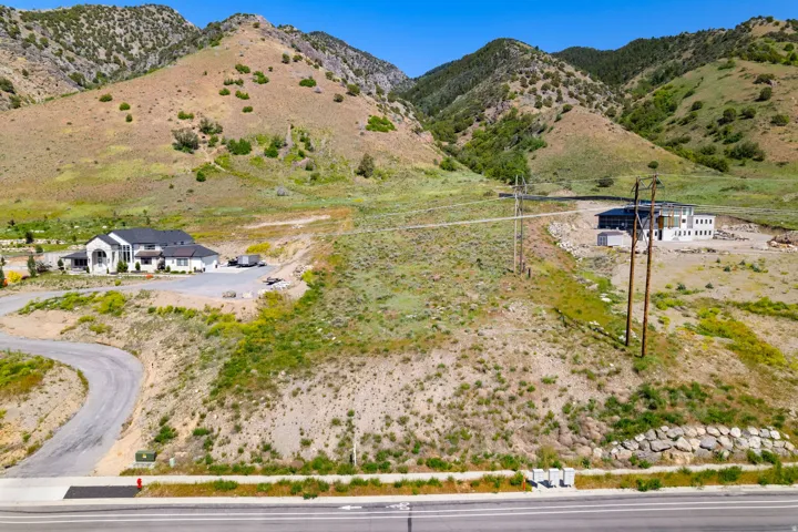 Expansive lot featuring natural landscaping and mountain scenery