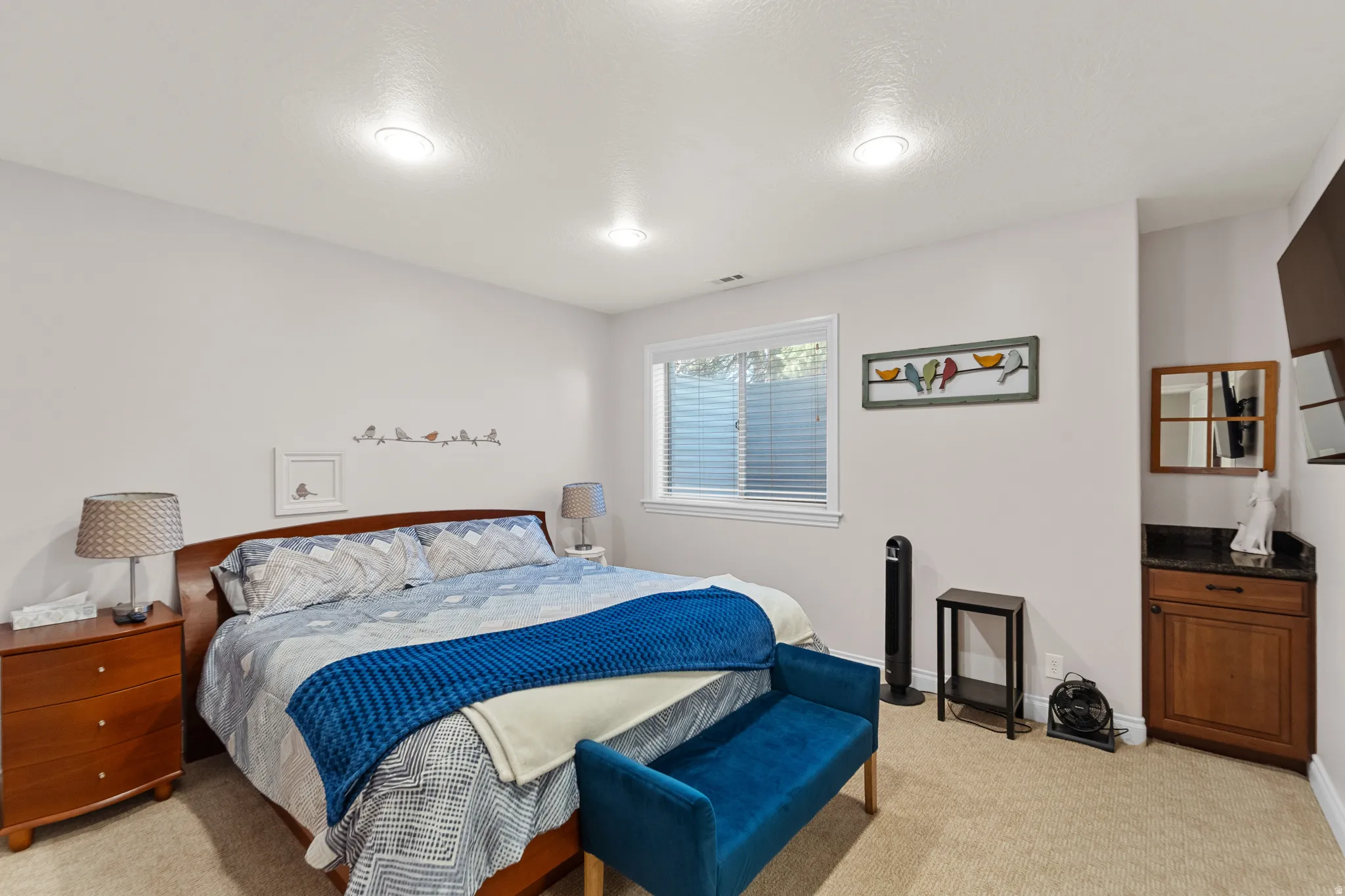 Bedroom featuring light wall color, recessed lighting, a single window with blinds, and carpet flooring