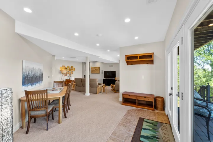 Lower level recreation room featuring recessed lighting and carpeted flooring