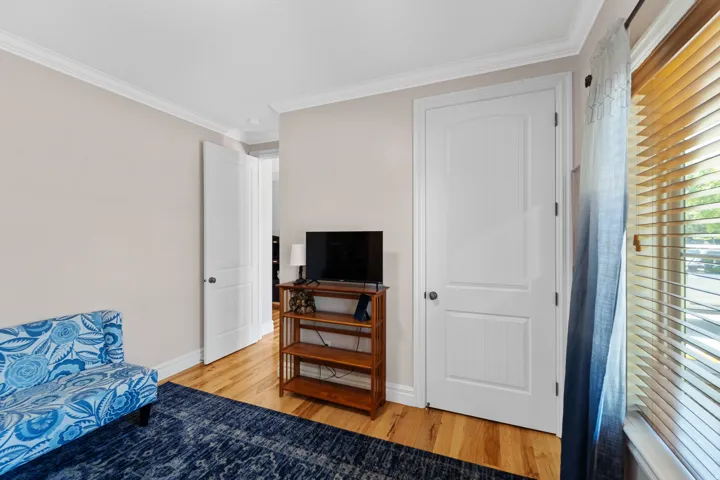 Hardwood flooring paired with light-toned walls and crisp white trim