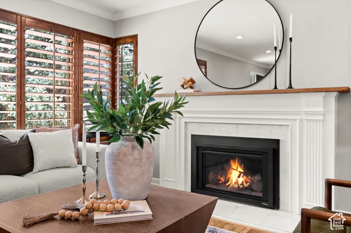 Built-in fireplace with a white mantel and wood-finish top