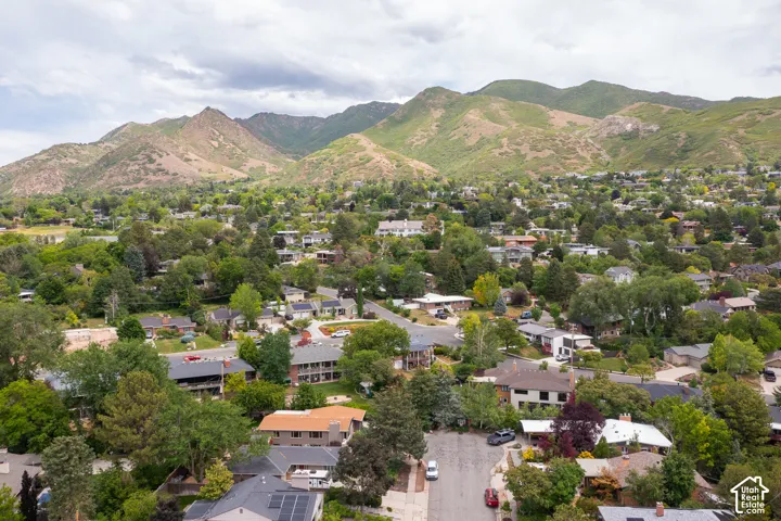 Lush, green mountains providing a striking natural backdrop for this residential area