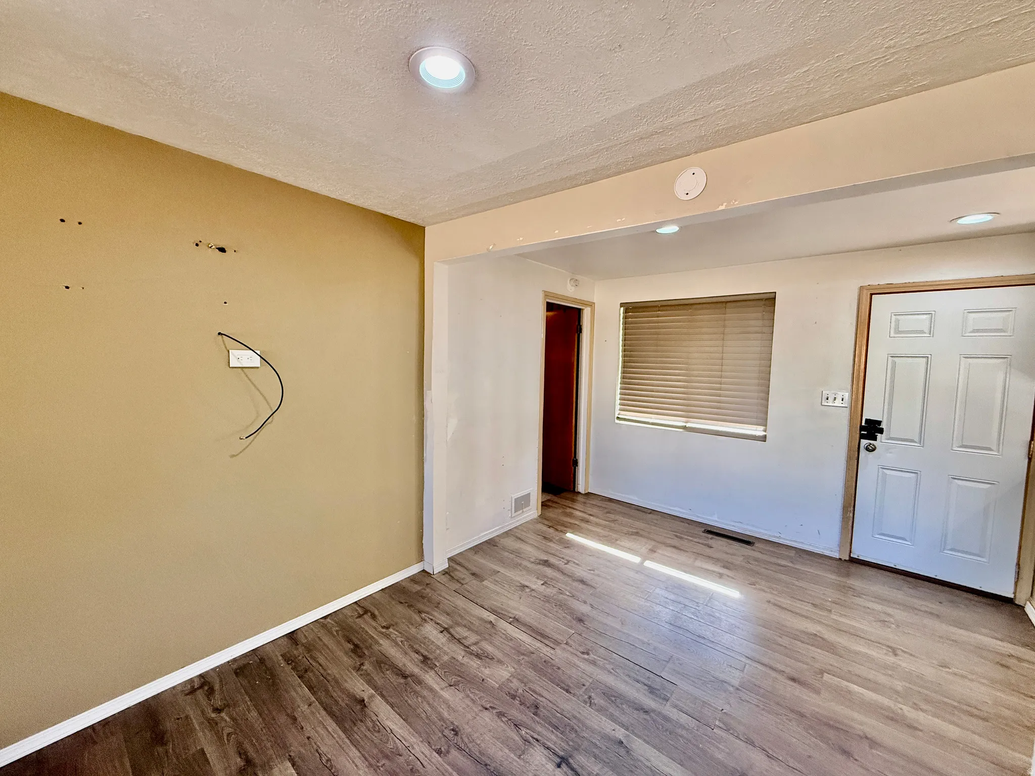 Wood-finish flooring throughout the space