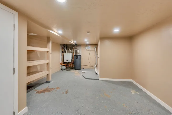 Basement area featuring a concrete floor, recessed lighting, and a neutral wall palette