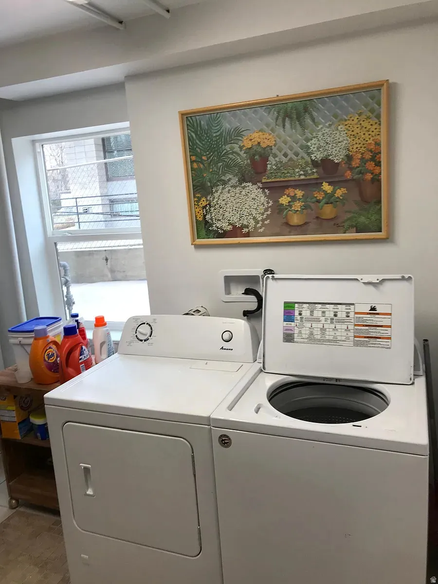 Laundry room with washing machine and dryer
