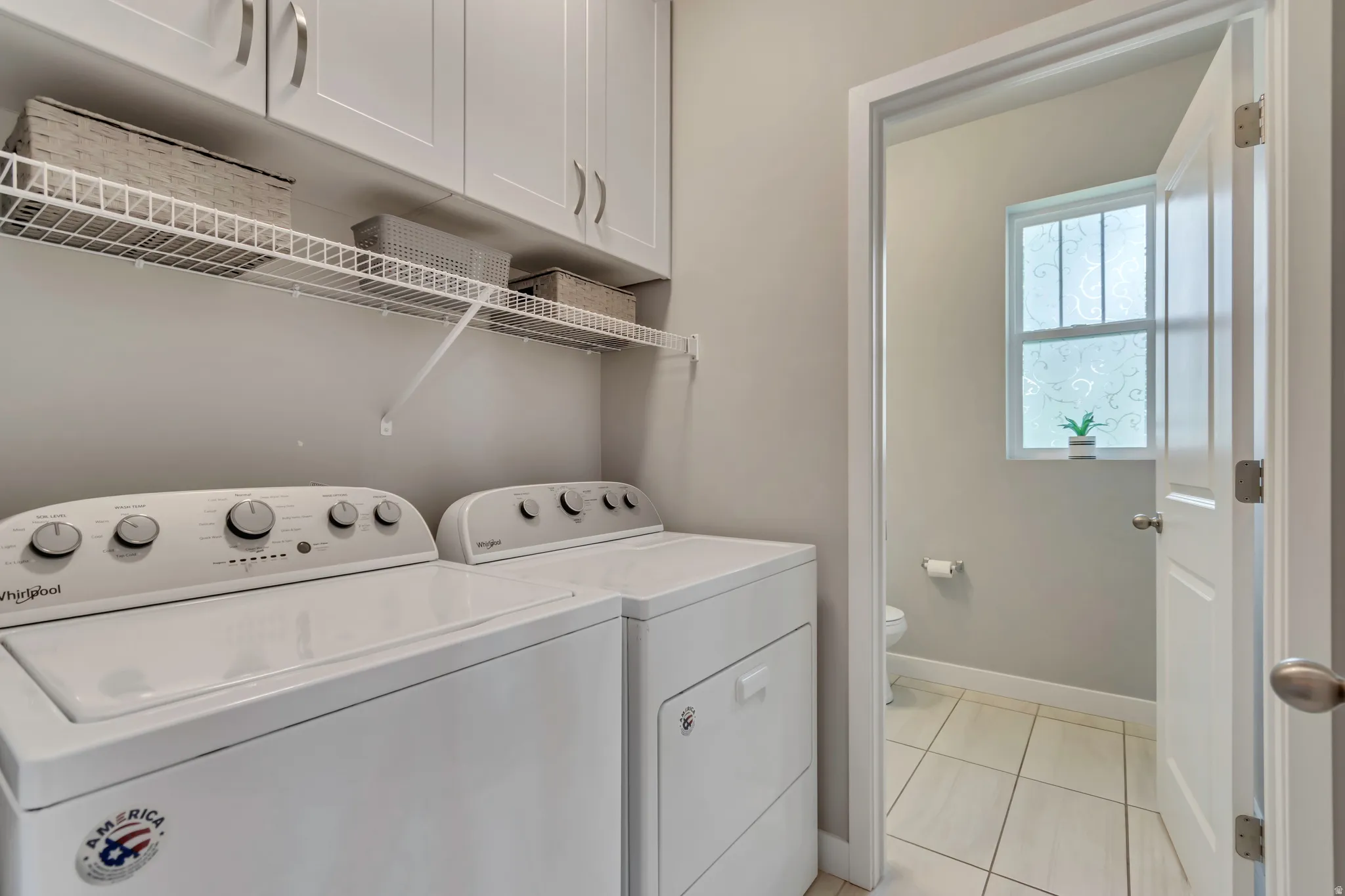 A convenient main-level half bath sits right past the laundry room.