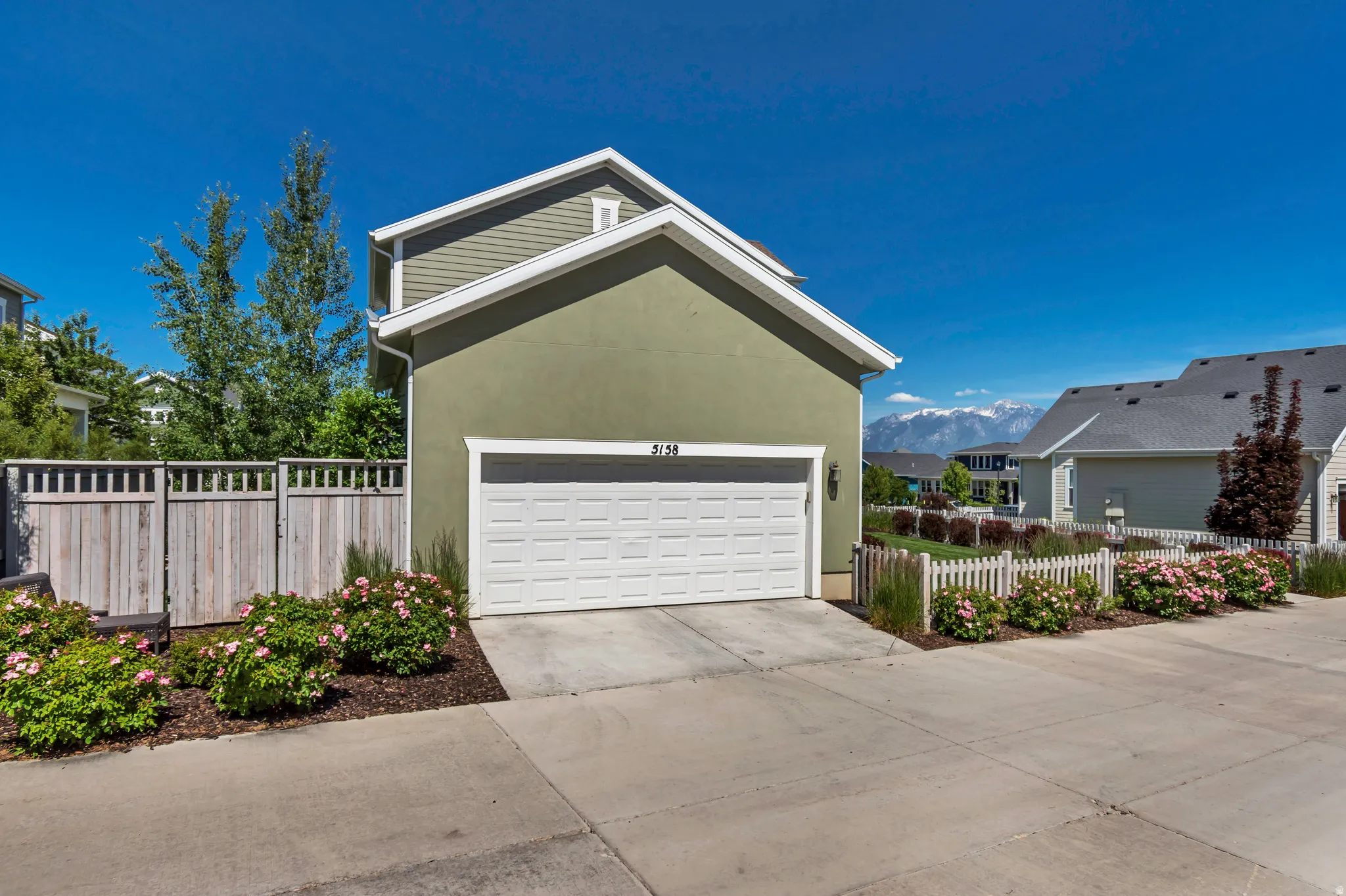 The garage entry from the common driveway/alleyway greets you with a warm welcome every time you come home.