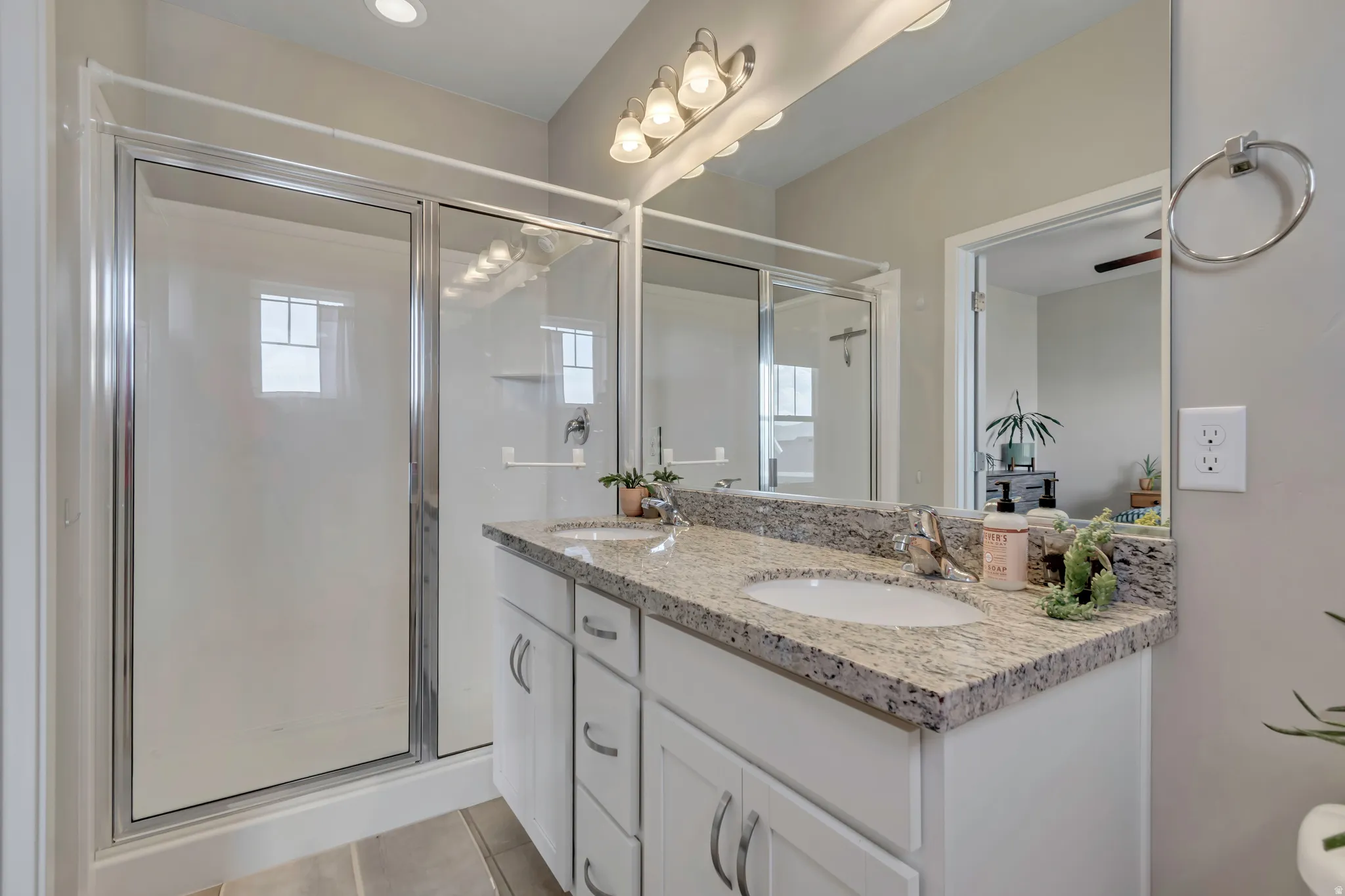 Who wouldn't appreciate this ensuite bathroom, complete with double sinks and granite counters.