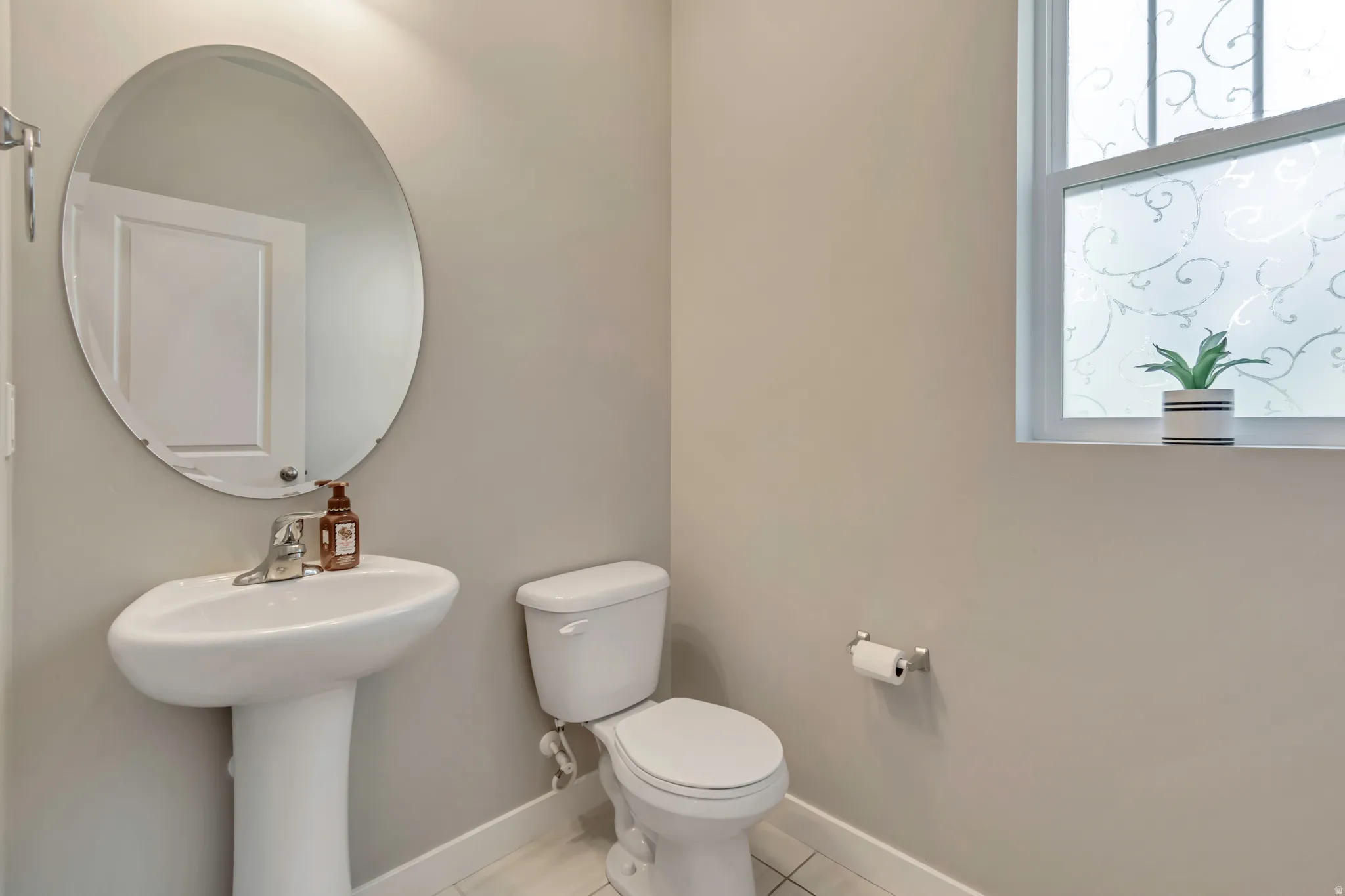 Guests will appreciate the conveniently located main-level half bath.