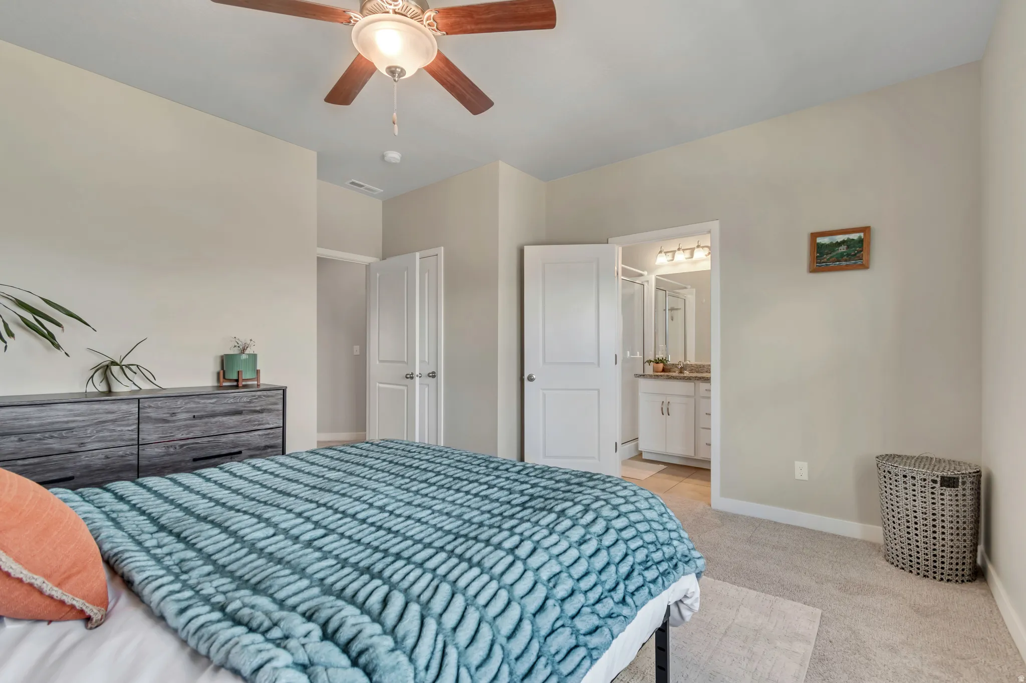 Roomy and relaxing primary bedroom with its own private ensuite - your personal retreat.