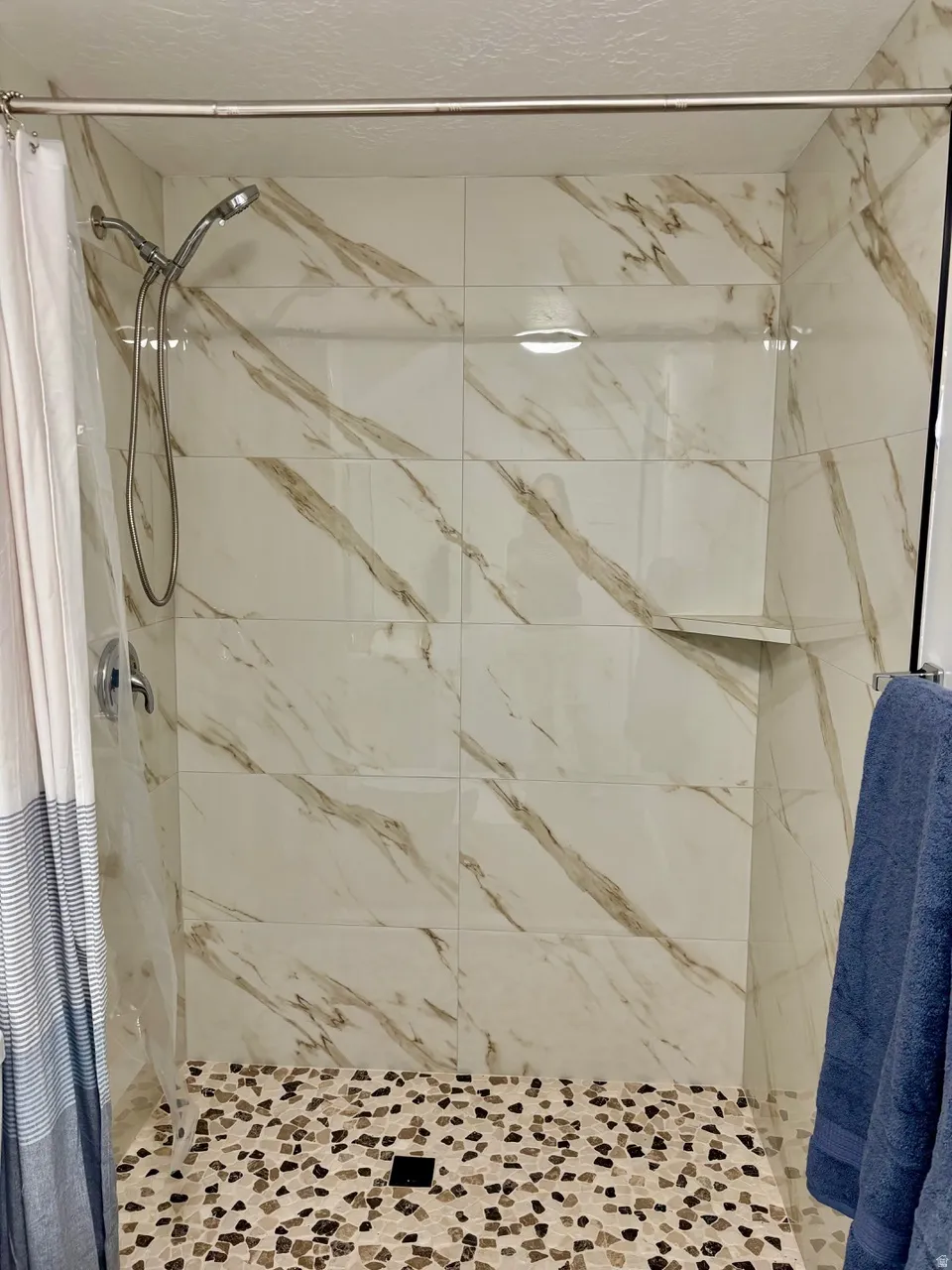 Detail of walk in shower in basement bathroom
