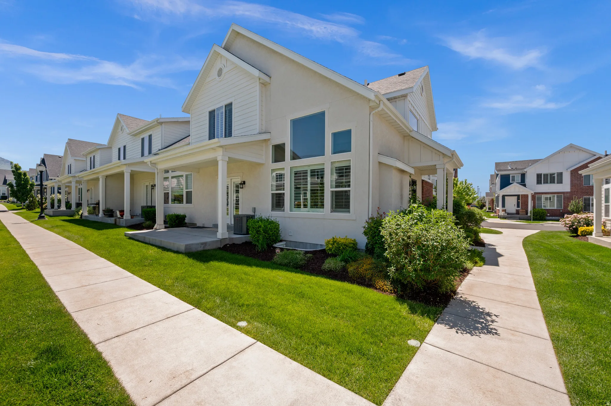 White exterior with gabled roof lines and board and batten siding accents