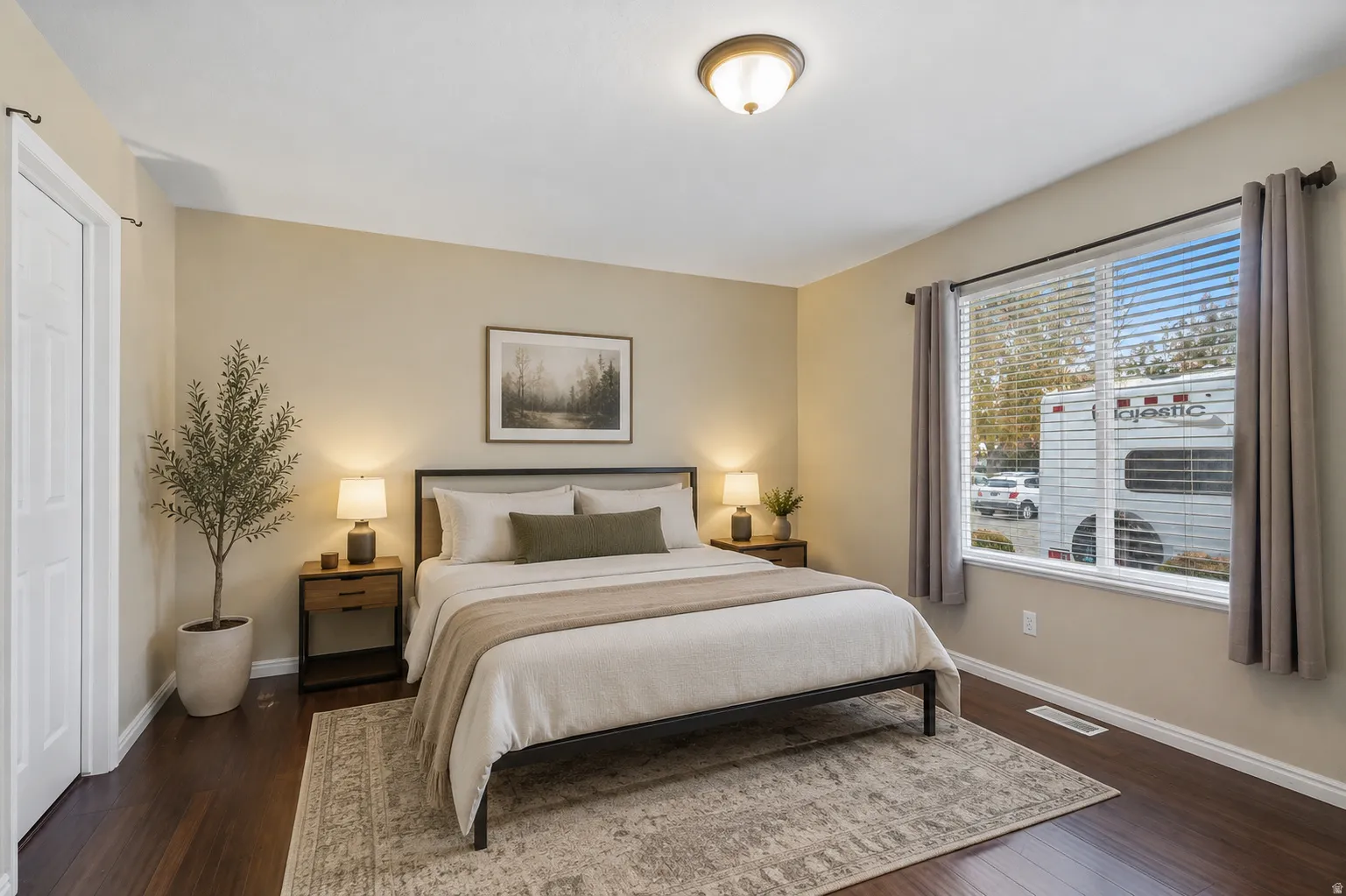 Dark wood-finish flooring with light wall tones