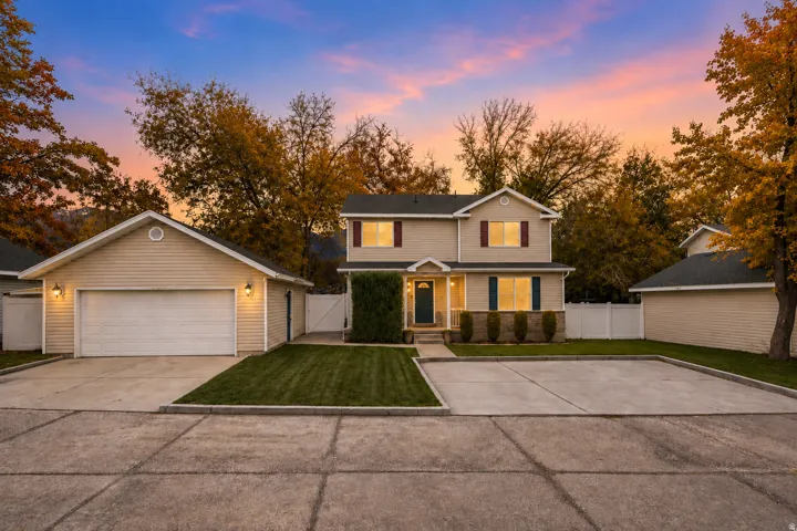 Two-story residence with a detached garage and a separate outbuilding