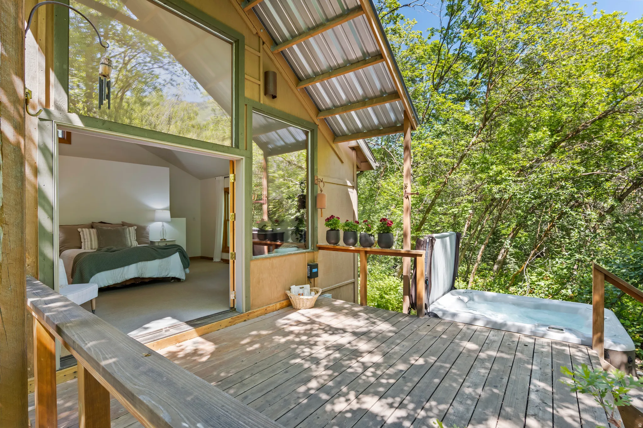 Expansive wood deck with an integrated hot tub right off the master bedroom
