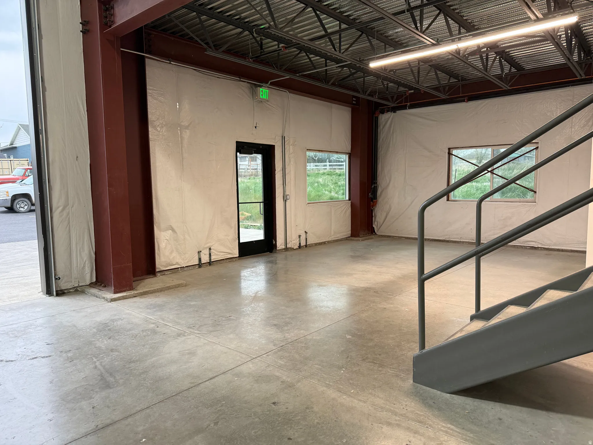 Expansive concrete floor space with exposed steel beam construction