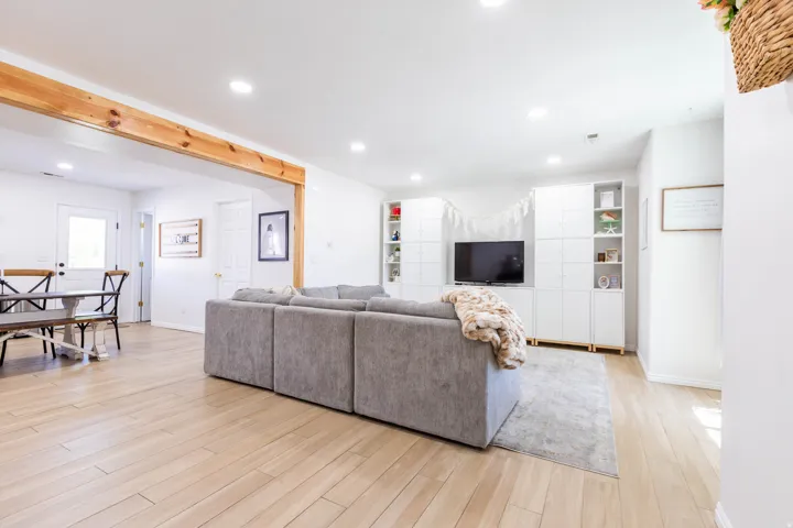 Light wood-finish flooring extending throughout the space