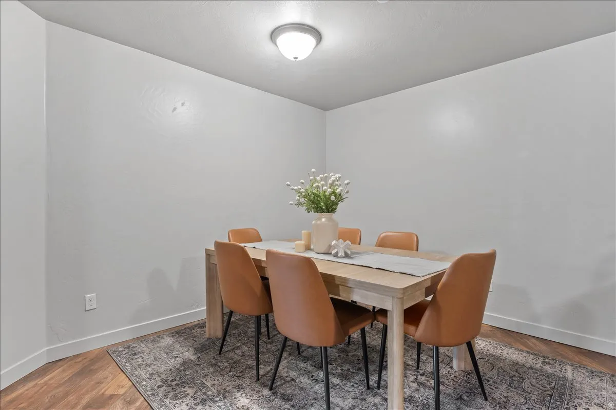 Neutral paint tones complement wood-finish flooring and white baseboards