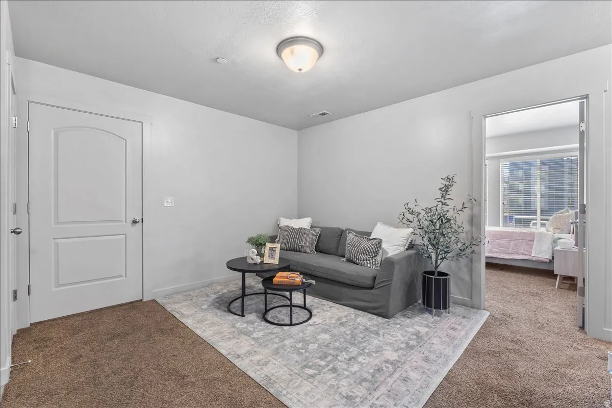 Versatile room featuring light grey wall paint and brown carpet flooring