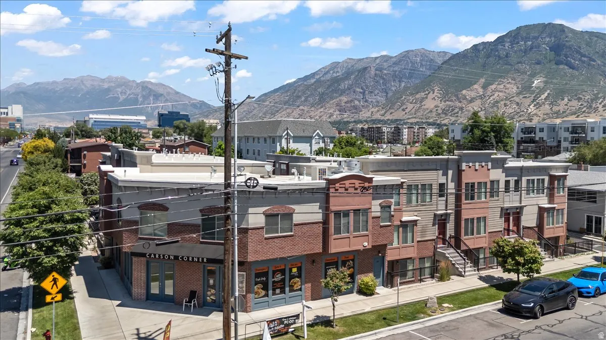 Mixed-use development featuring retail spaces on the ground floor and multi-story residential units above