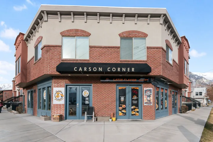 Corner commercial building with a brick and stucco facade