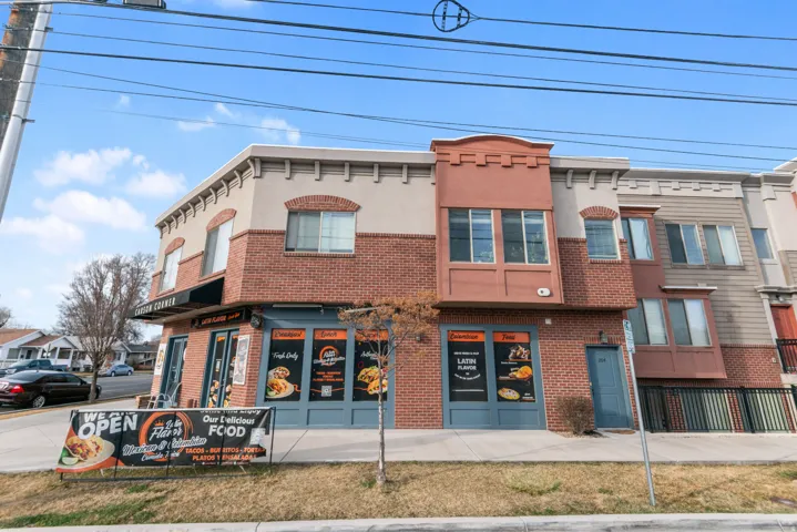 Mixed-use building featuring brick and stucco exterior