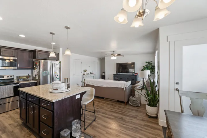 Open-concept living space with wood-finish flooring