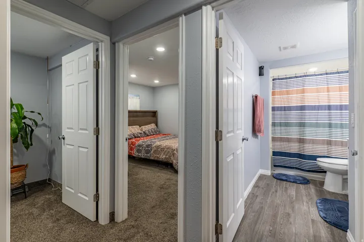 Interior hallway with light blue walls and white trim