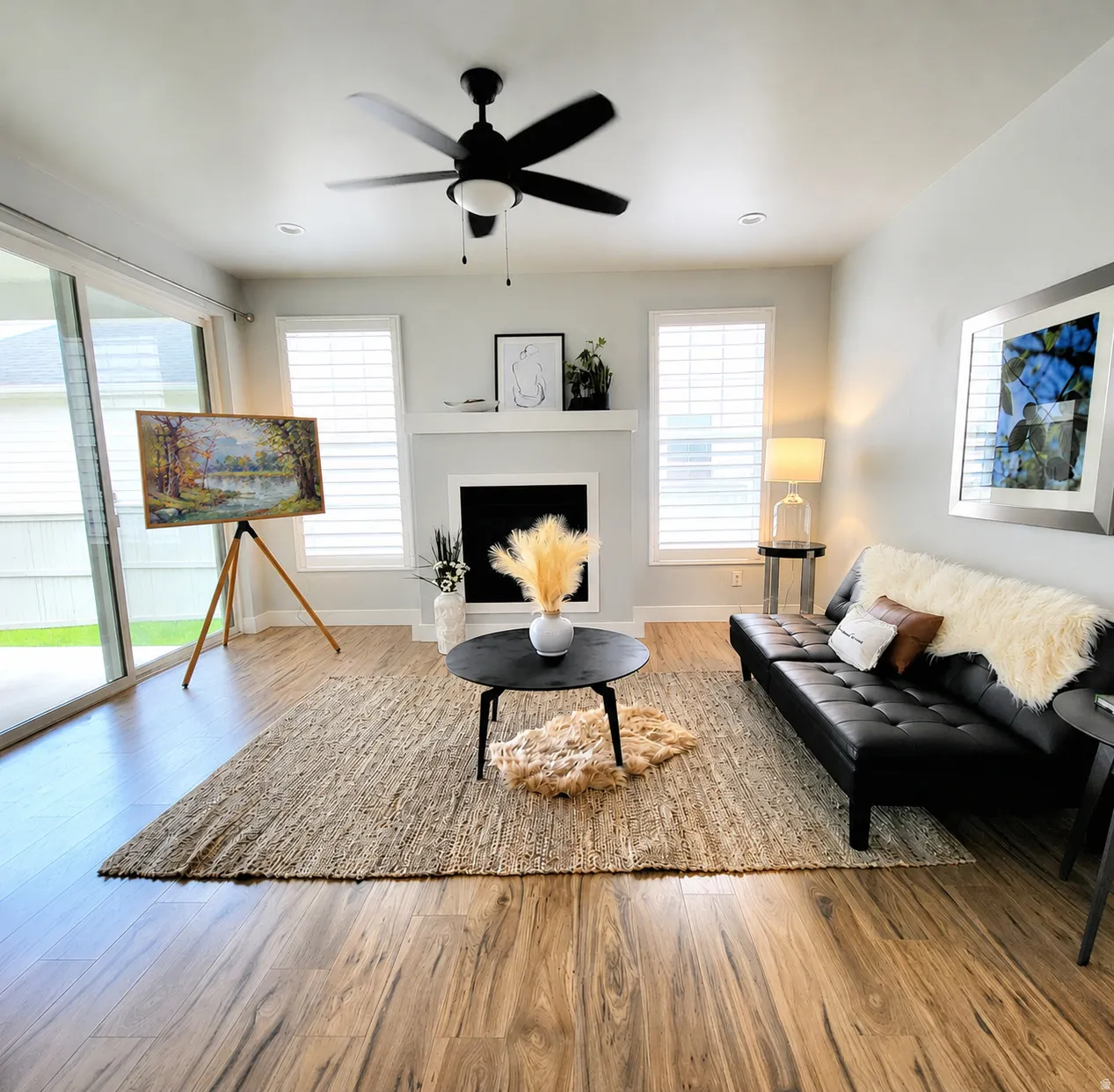 Living space with portrait TV on easel (virtually added), with current furniture