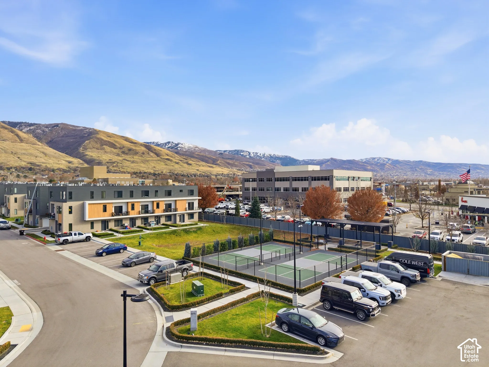 Modern townhome development featuring multi-level units with private balconies and contemporary exterior finishes