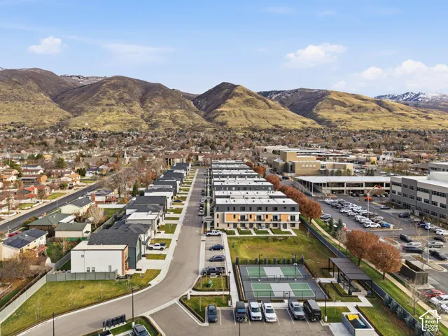 Modern townhouse development featuring organized rows of residences with flat roofs and varying facade treatments