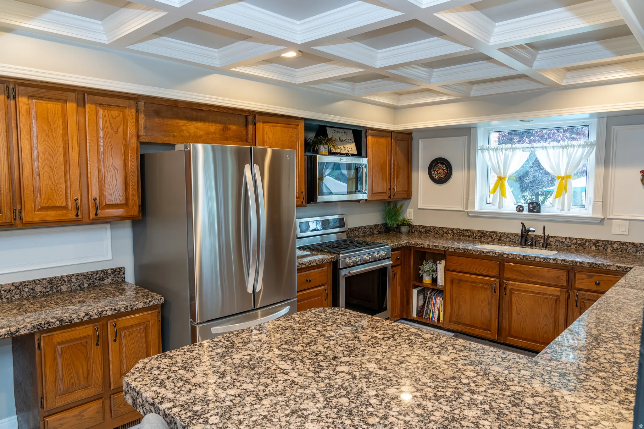 Kitchen featuring a coffered ceiling with recessed lighting