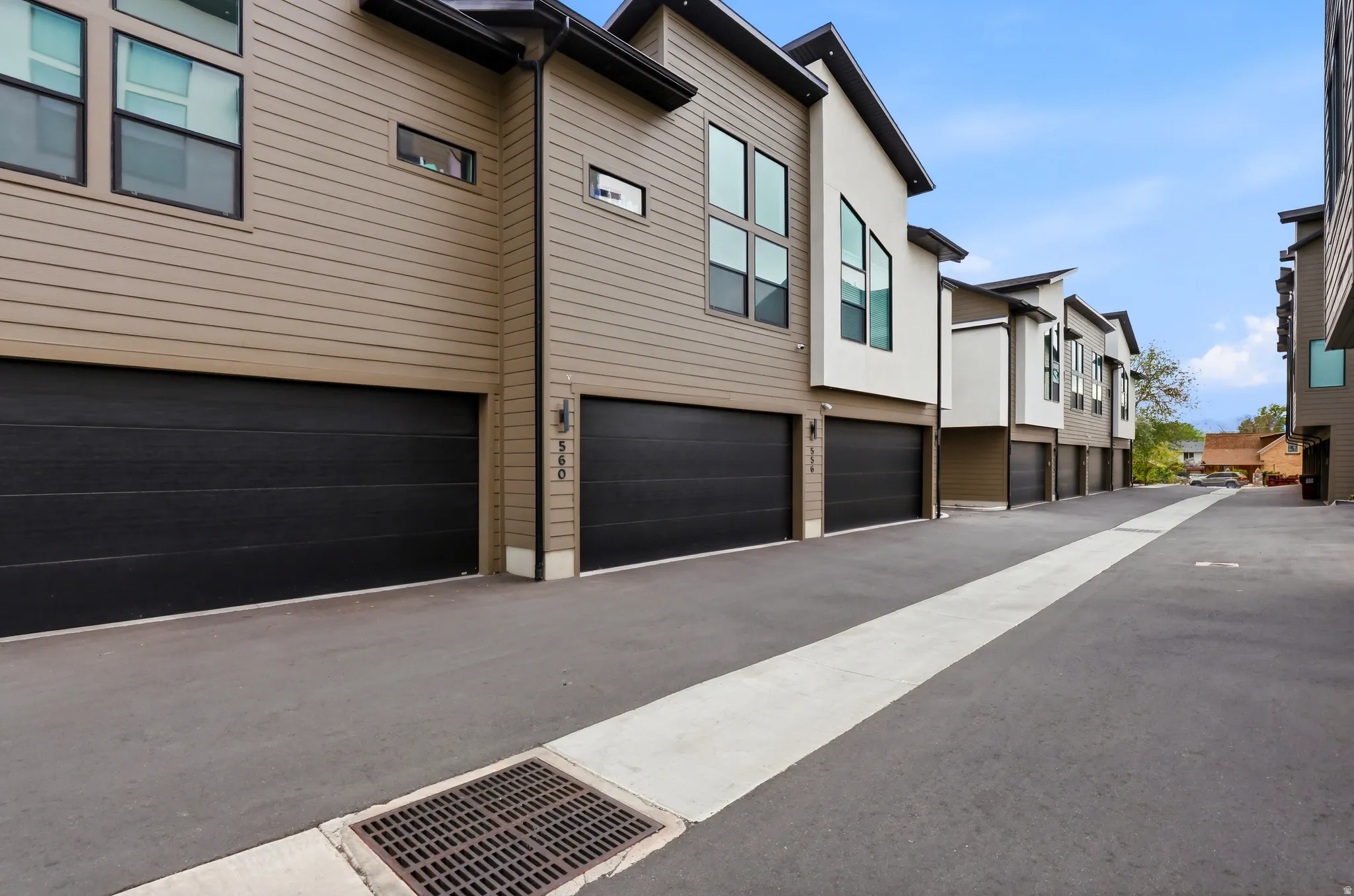Modern townhome development featuring a row of units with contemporary architectural design