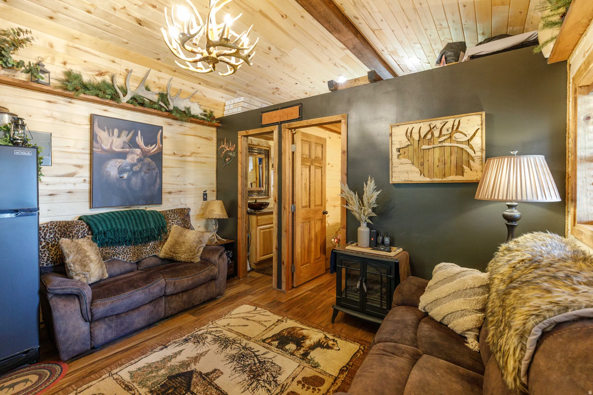 Interior space featuring wood-finish wall paneling and a coordinating wood-finish ceiling