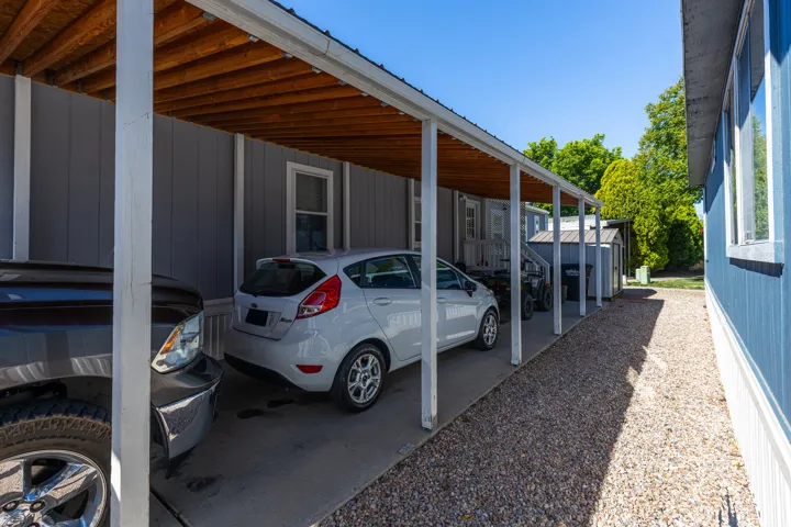 Covered carport parking on concrete pad