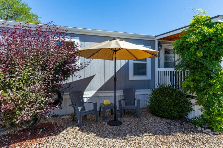 Exterior featuring light blue vertical siding and white trim