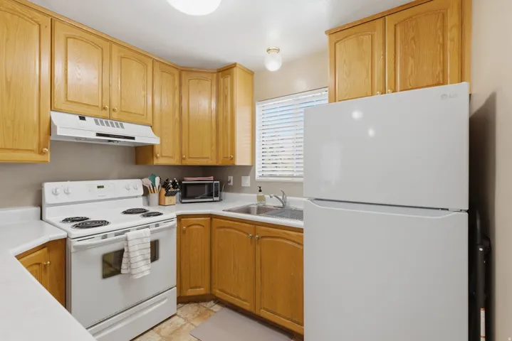 Kitchen has newer dishwasher and refrigerator
