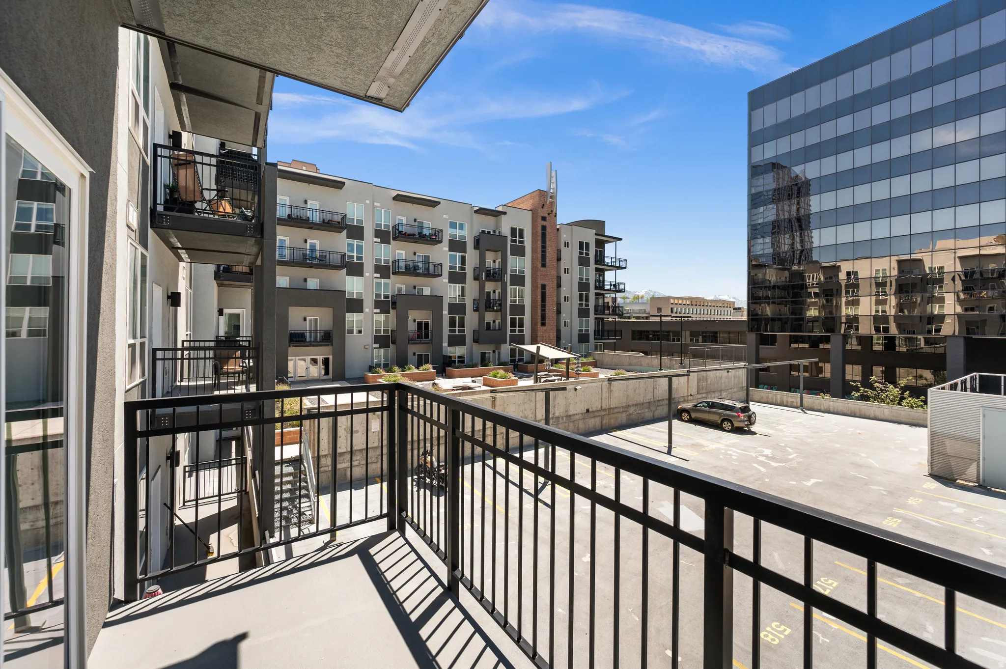 Private outdoor balcony with black metal railings