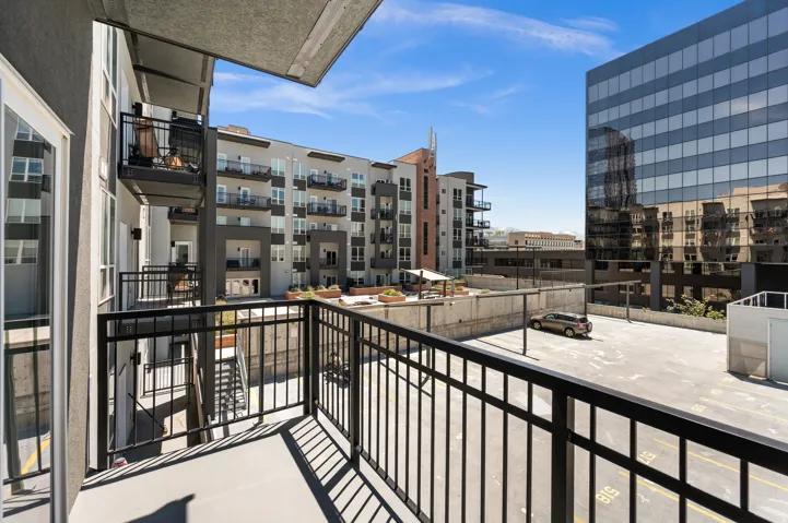 Private outdoor balcony with black metal railings