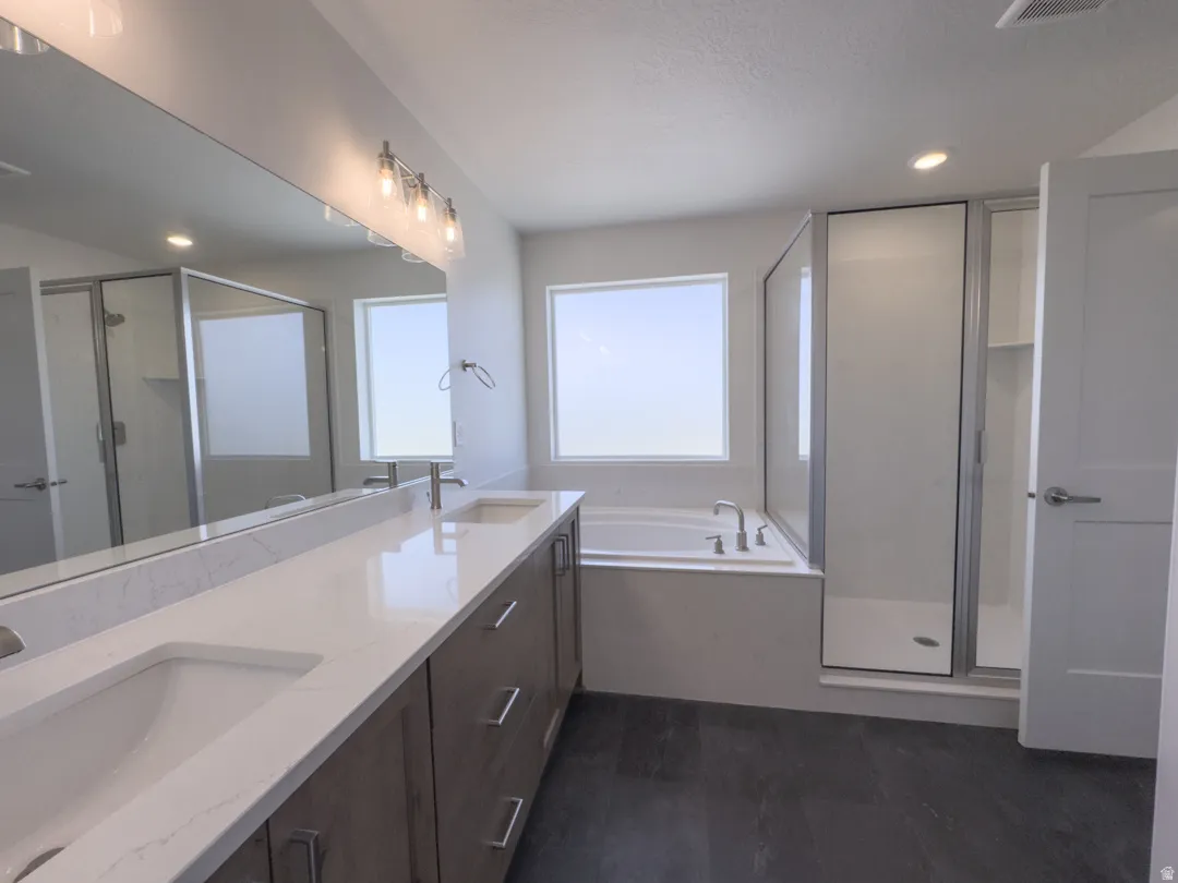 Dual vanity with white undermount sinks and light-toned countertops