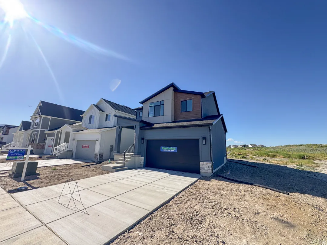 Contemporary two-story residence featuring a dark gray and wood-tone exterior facade