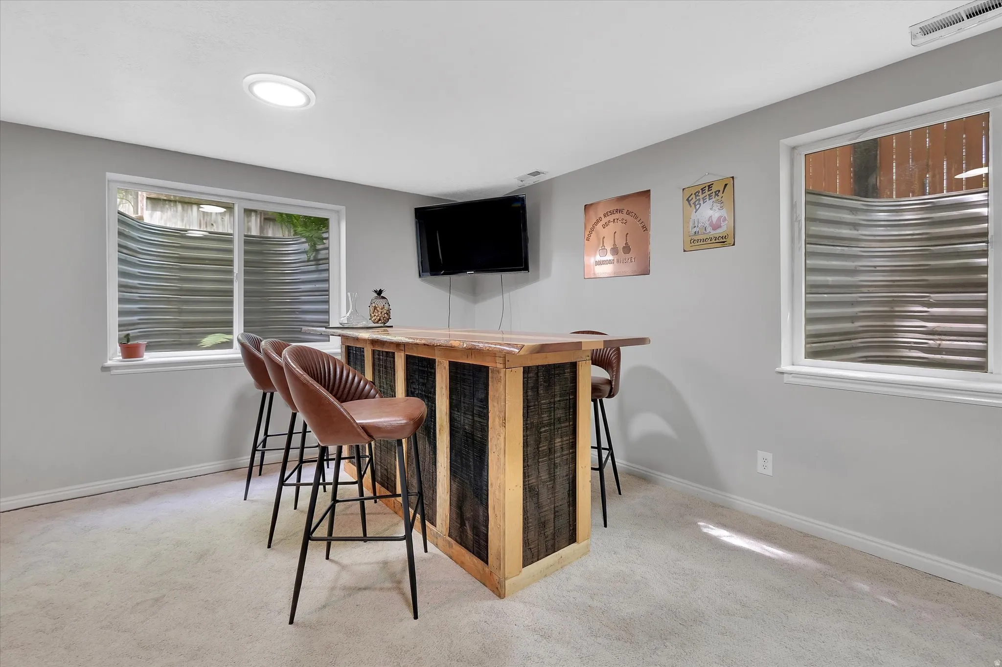 Reclaimed wood-paneled bar with a solid wood countertop