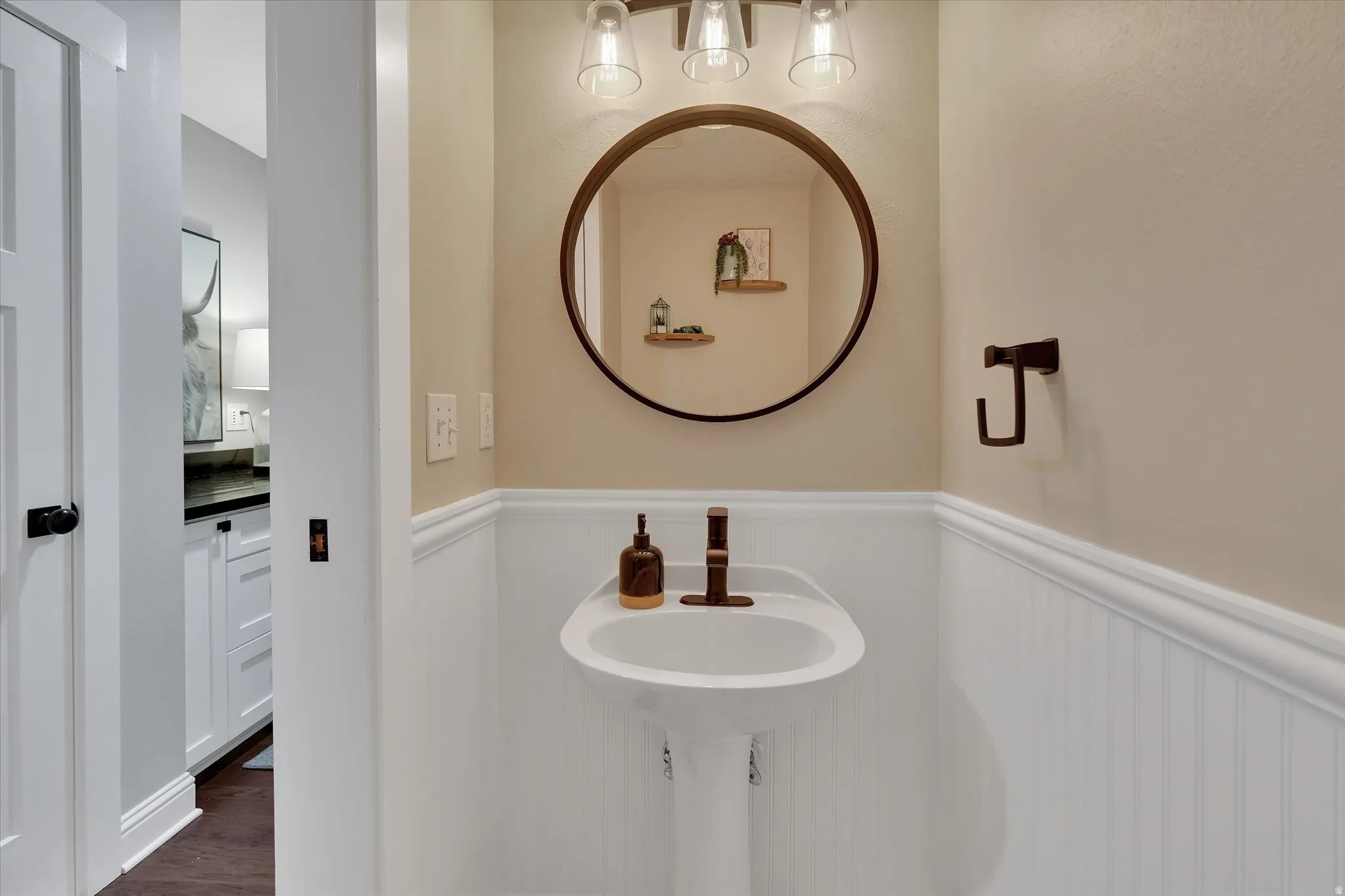Pedestal sink with bronze faucet