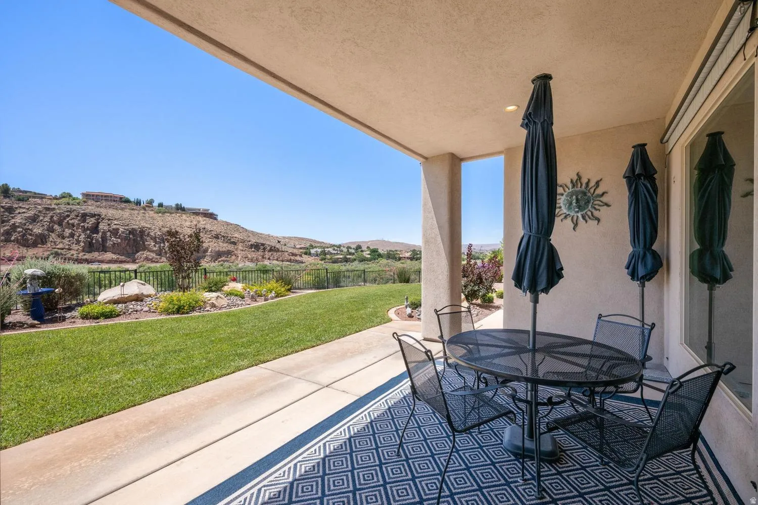 Expansive covered patio featuring a concrete surface, recessed lighting, and a neutral stucco exterior