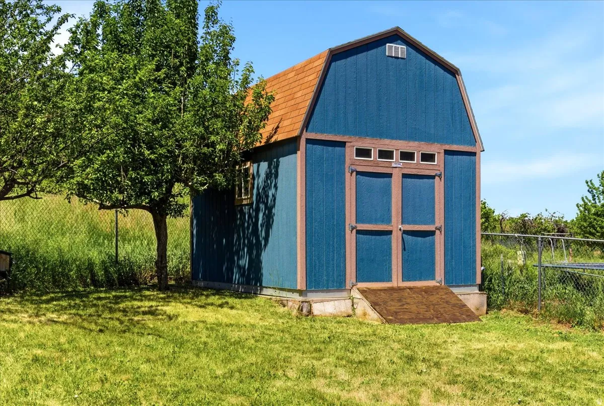 Storage shed included