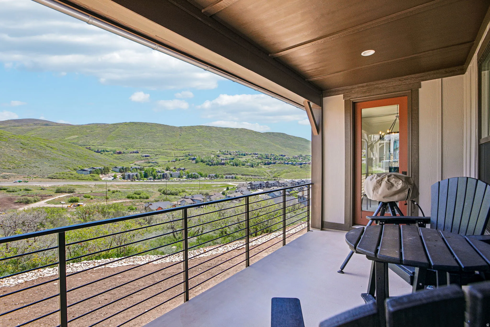 Covered patio featuring a solid ceiling, recessed lighting, and a glass-paneled door