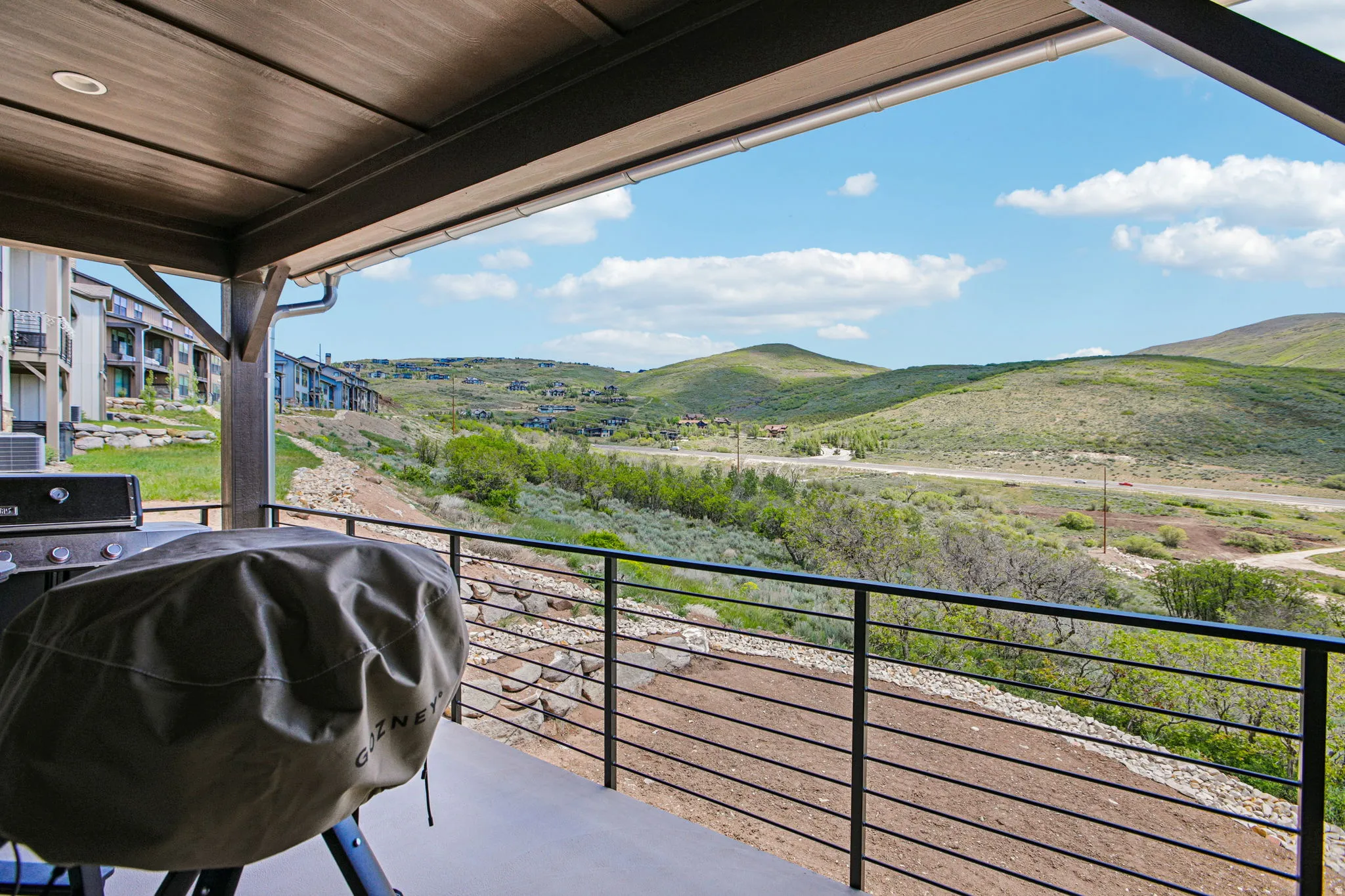 Covered patio featuring a wood-finish ceiling, recessed lighting, and a metal railing