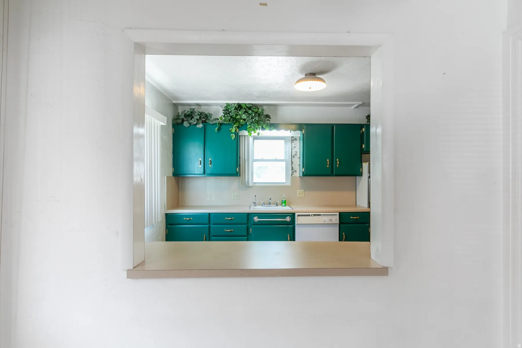 Kitchen pass-through window with a laminate counter