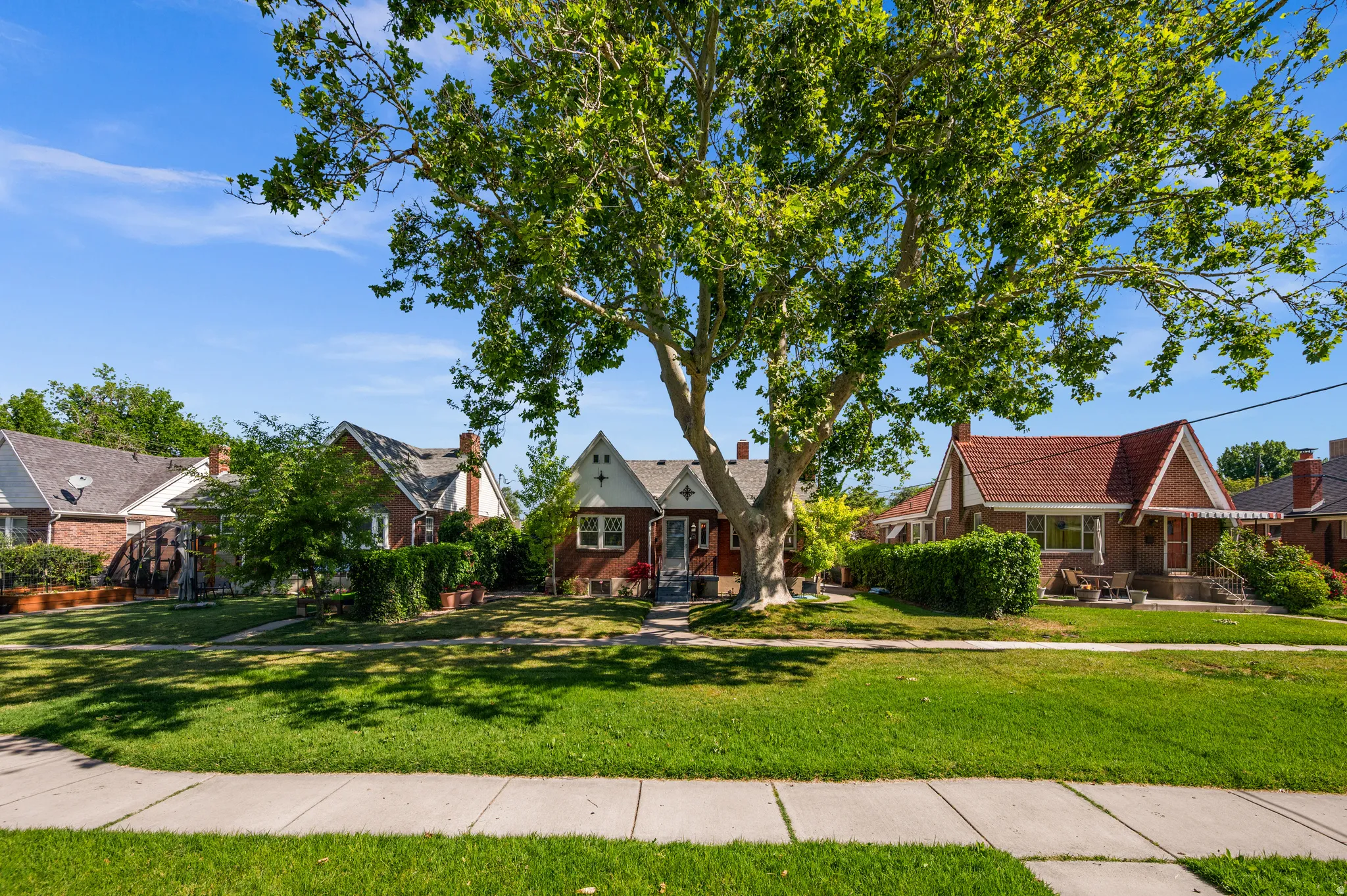 Brick exterior with a red tile roof and white trim